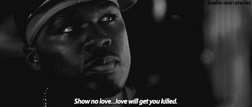 a man with a hat on his head and a quote in front of him that says, show me love will get you killed