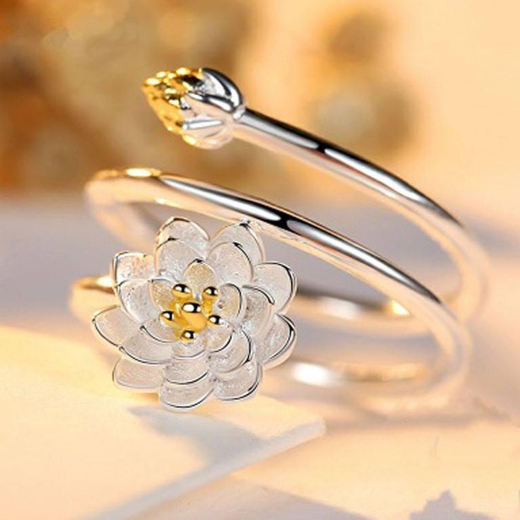 This chic and fancy ring features a lotus flower that beautifully wraps your finger once you wear it. It is crafted from high quality Alloy with Silver plating. In Buddhism, the lotus is known to be associated with purity, spiritual awakening and faithfulness. The flower is considered pure as it is able to emerge from murky waters in the morning and become perfectly clean. Have this unique ring for yourself or as a gift to someone special in your life. Ring size is adjustable. Girlfriend Jewelry Gift, Lotus Flower Ring, Ring Party Jewelry, Lotus Ring, Womens Silver Jewelry, Girlfriend Jewelry, Fancy Rings, Finger Rings, Rings For Girls