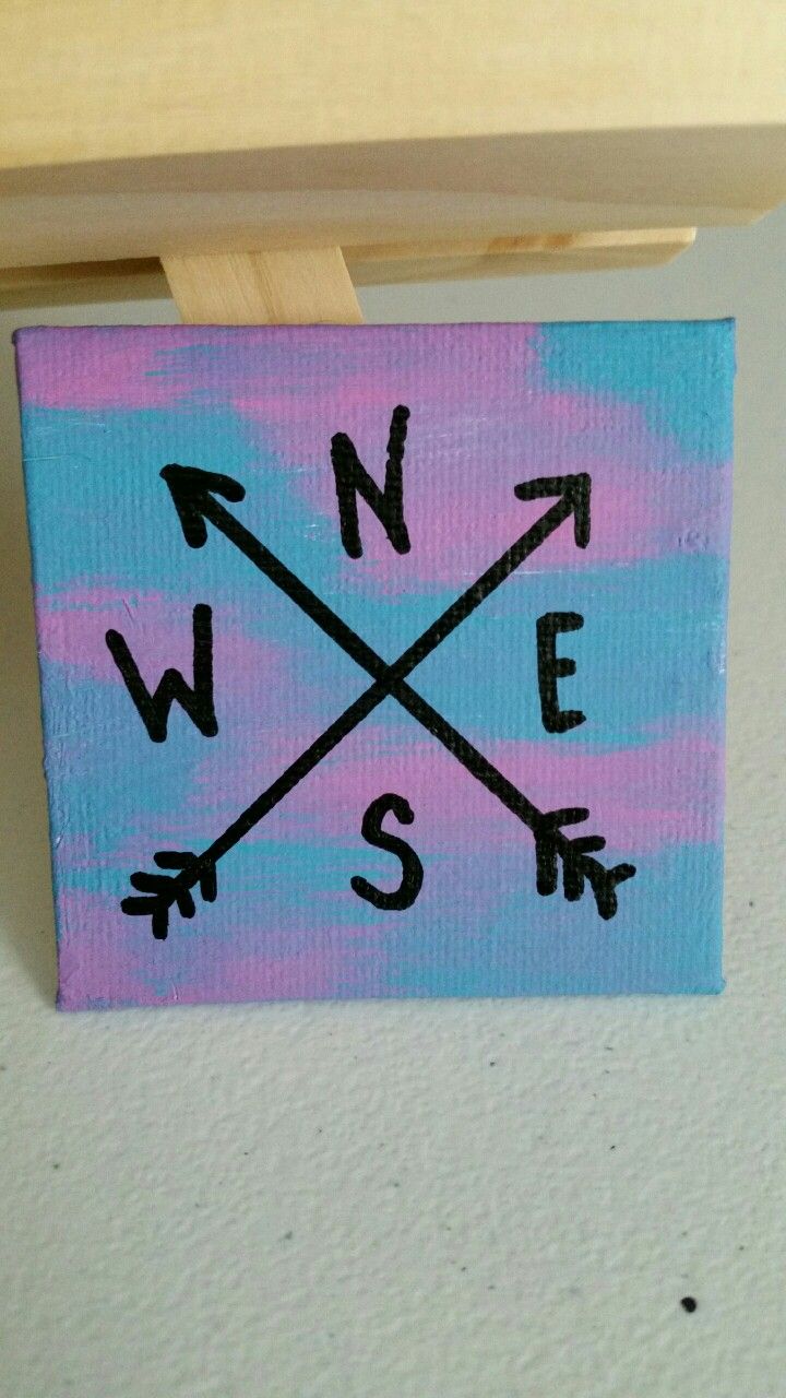 a small painting with an arrow on it