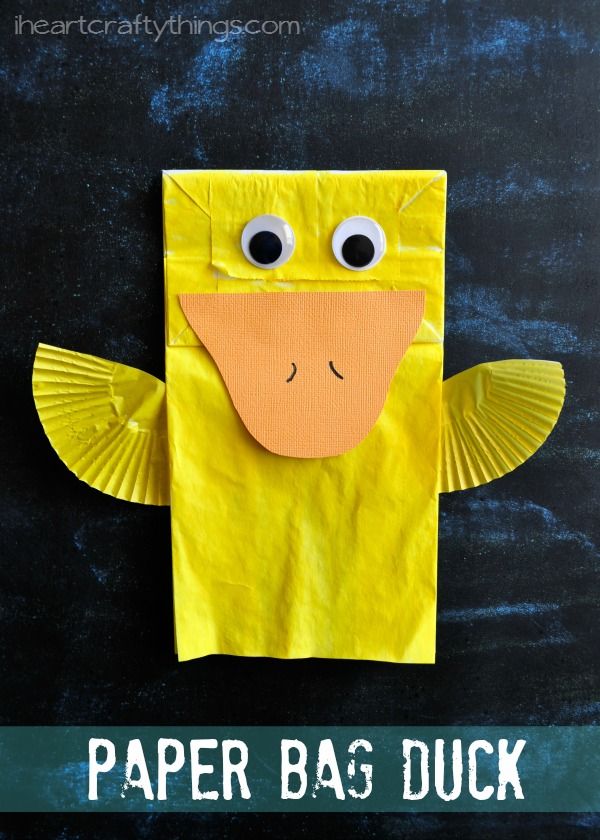 a yellow paper bag with eyes on it and the words paper bag duck in front of it