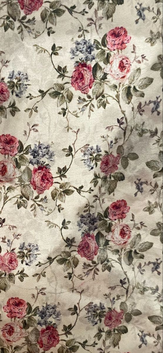 a floral fabric with pink and blue flowers on it