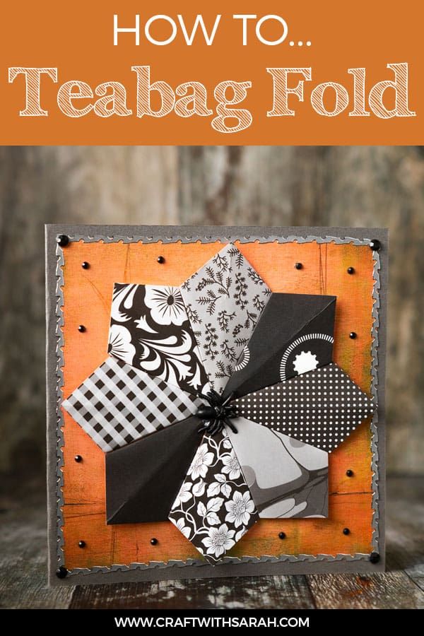 an orange box with black and white fabric on it that says how to teabag fold