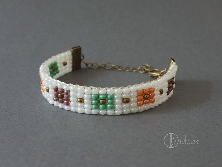 Bracelet made of multicolored glass beads in combination with a metal or leather chain. Bohemian White Rectangular Bracelets, Bohemian White Rectangular Bracelet, White Bohemian Rectangular Bracelet, Adjustable Beaded Chain Bracelet In Glass, Adjustable Beaded Chain Glass Bracelet, Adjustable Beaded Glass Bracelets, Adjustable Beaded Glass Chain Bracelet, Multicolor Rectangular Bracelets, Multicolor Rectangular Bracelets For Fashion