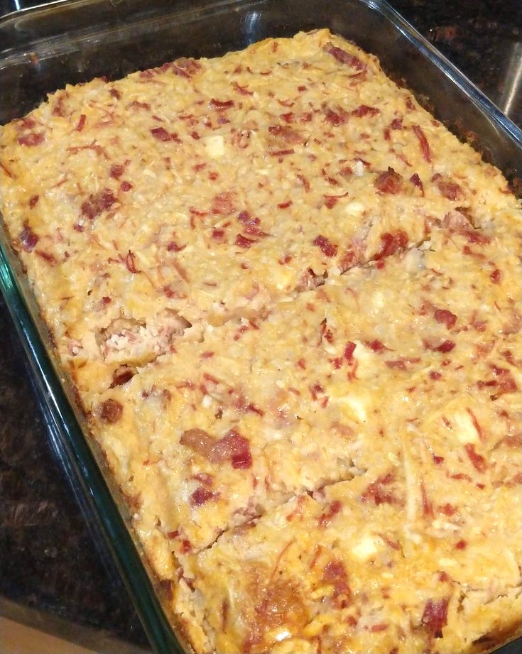 a casserole dish with meat and cheese in it sitting on a counter top