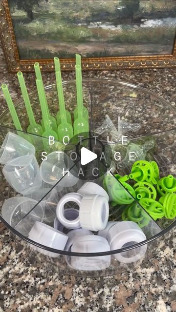 a bowl filled with lots of green plastic items