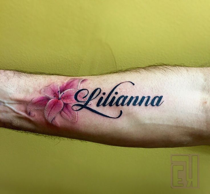 a man's arm with a flower tattoo on it that says, lilanna