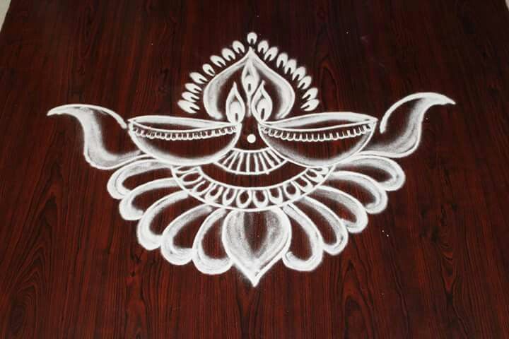 an intricately designed wooden table top with white paint on the wood grained surface