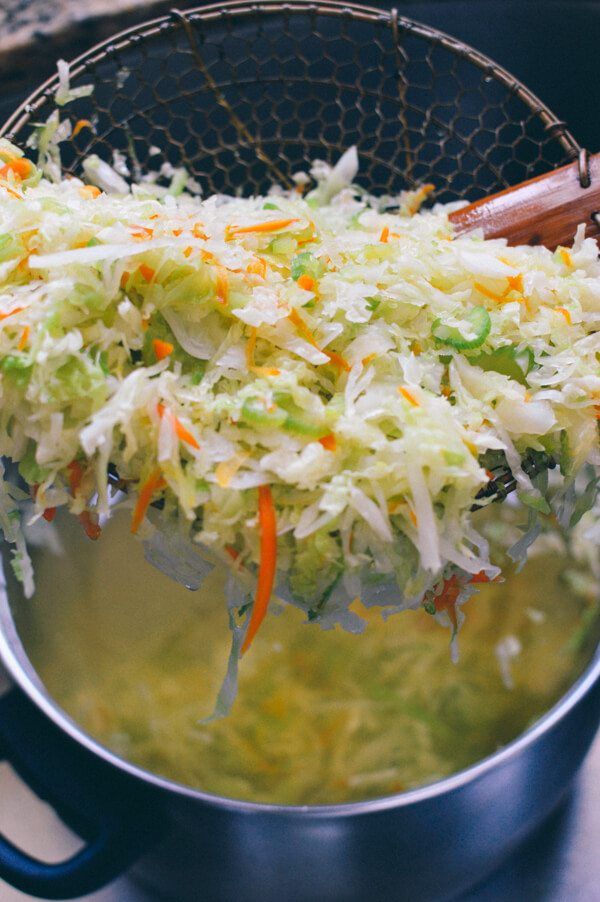 the food is being cooked in the pot on the stove top and ready to be eaten