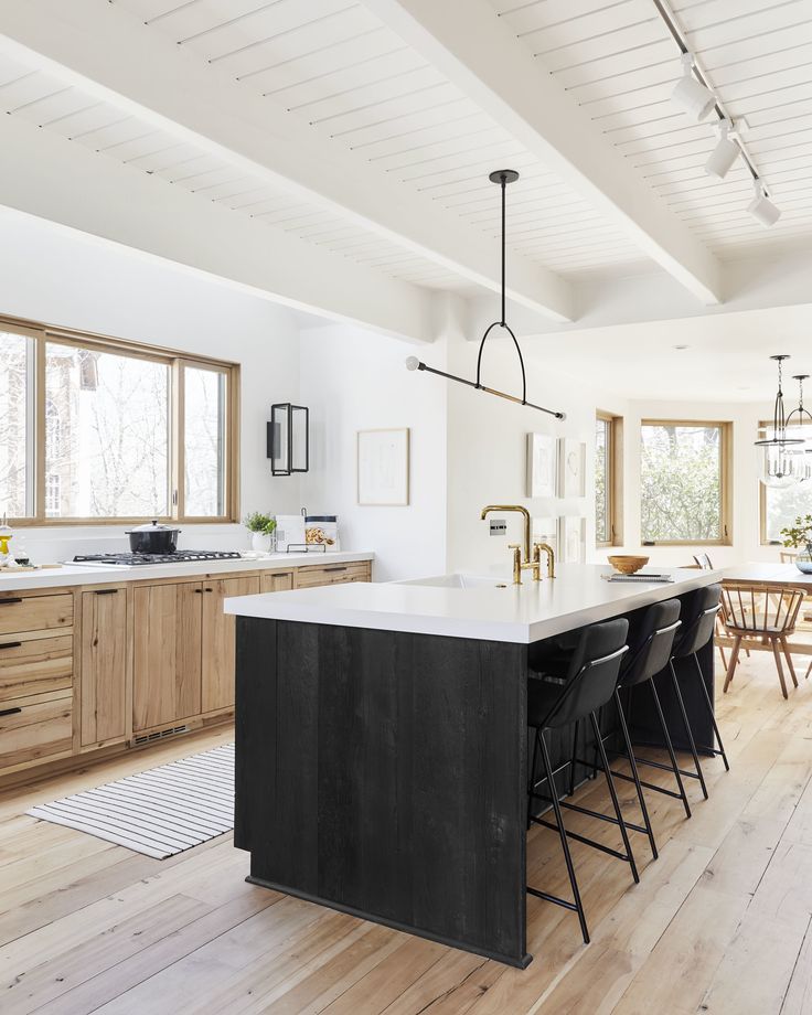 a large kitchen with an island in the middle