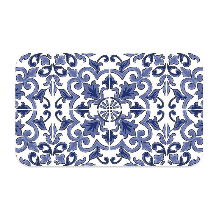 a blue and white tray with an ornate design