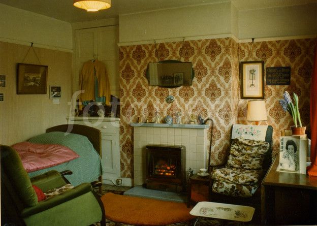 a living room filled with furniture and a fire place