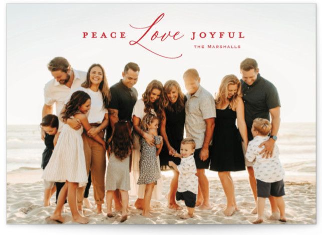 a group of people standing next to each other on a beach with the words peace love joyful