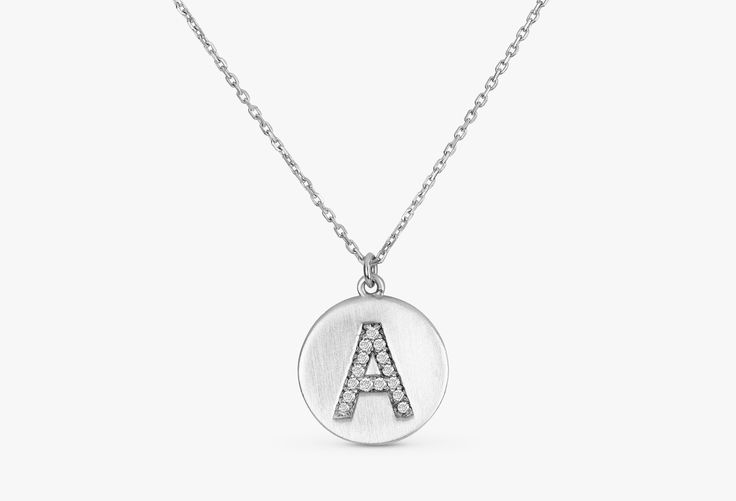 Total Carat Weight (approximate): .08 Size of Disc: 12mm This pave diamond initial on an 12 mm disc is the perfect way to wear the name of someone you love! Want to wear more than one disc or stack it with other charms? Shop our Charms collection and build a necklace that is as unique as your personal story. Available 14K White, Yellow, Rose Gold Worldwide DHL shipping now available 1-3 business days NOW USING ITALIAN TRIGGER LOBSTER CLASPS 🛠 All Sarah Elise pieces are handcrafted to order, ple Elegant Silver Coin Necklace With Initial Pendant, Luxury Sterling Silver Initial Necklace For Formal Occasions, Elegant Personalized Silver Coin Necklace, Elegant Round Pendant Coin Necklace With Polished Finish, Elegant Silver Initial Pendant Medallion Necklace, Elegant Silver Medallion Necklace With Initial Pendant, Hallmarked White Gold Coin Necklace, Luxury Medallion Necklace With Brilliant Cut, White Gold Medallion Necklace For Formal Occasions