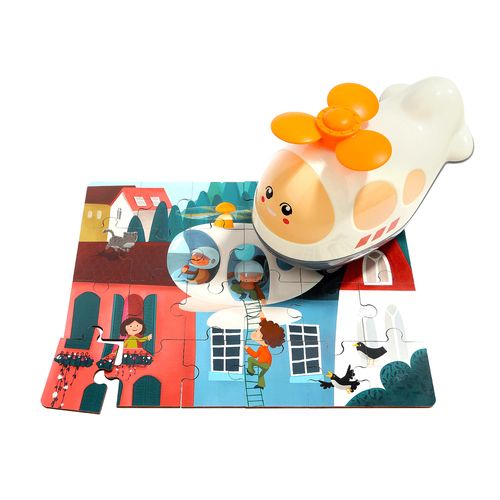 an orange and white toy is on top of some cards