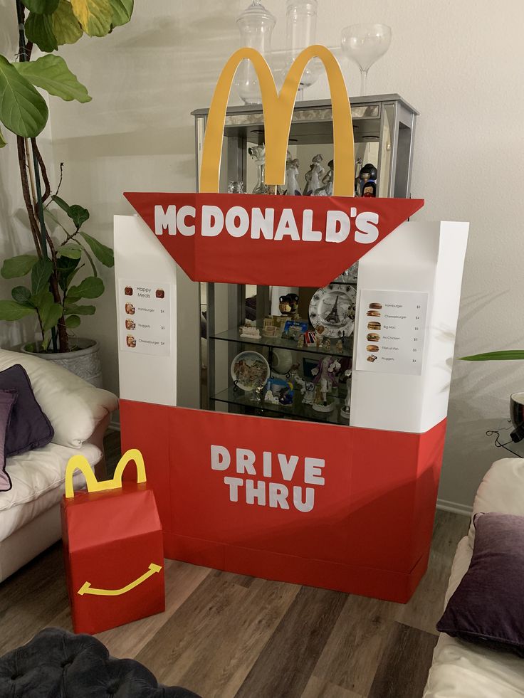 a mcdonald's drive thru display in the shape of a mcdonald's bag