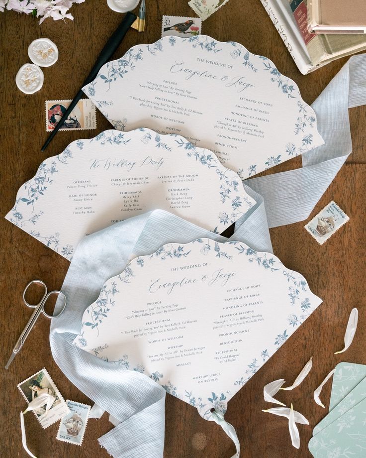 the wedding stationery is laid out on the table