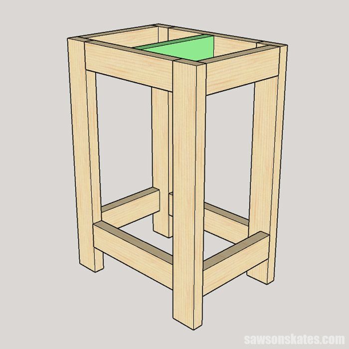 a wooden stool with a green seat on it's backrest and the bottom section missing