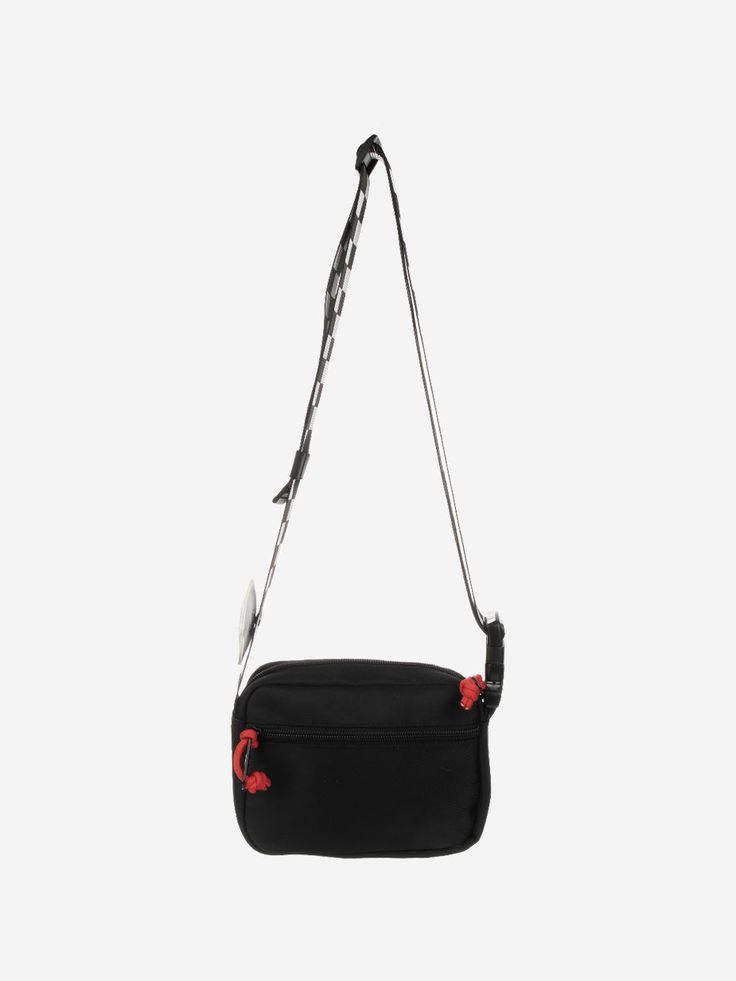 a black and red bag hanging from the side