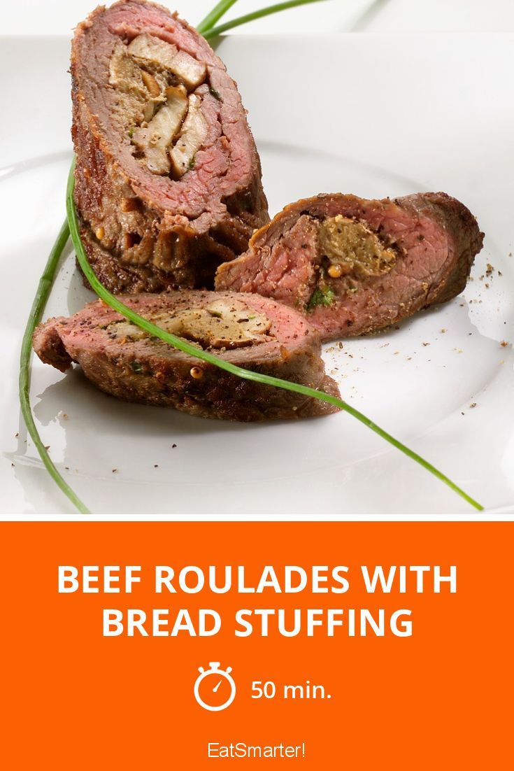 beef roulades with bread stuffing on a white plate and text overlay reads beef roulades with bread stuffing