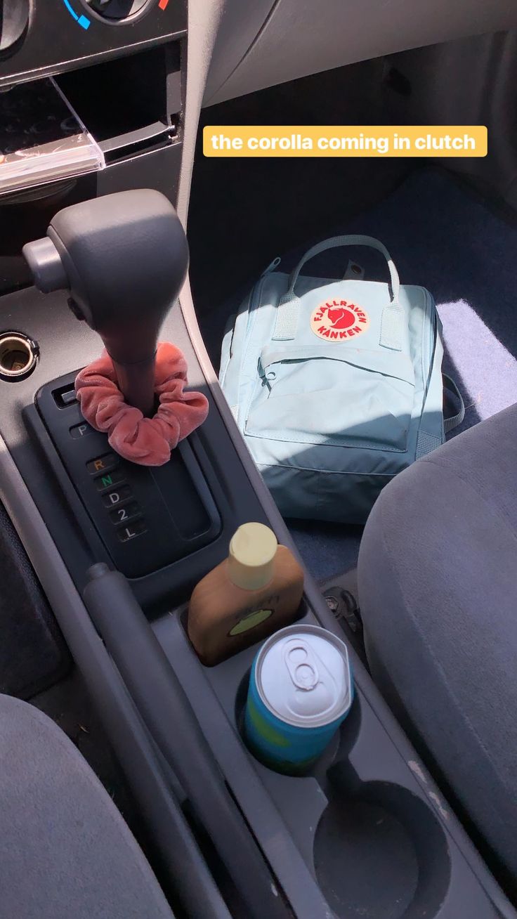 the interior of a car with various items in it