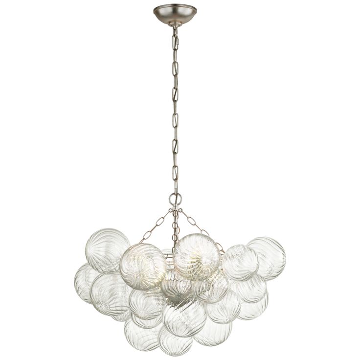 a chandelier with glass balls hanging from it's center point, on a white background