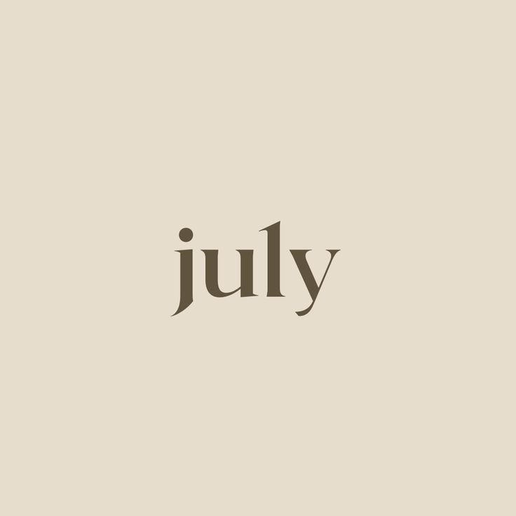 the word july written in black ink on a beige background