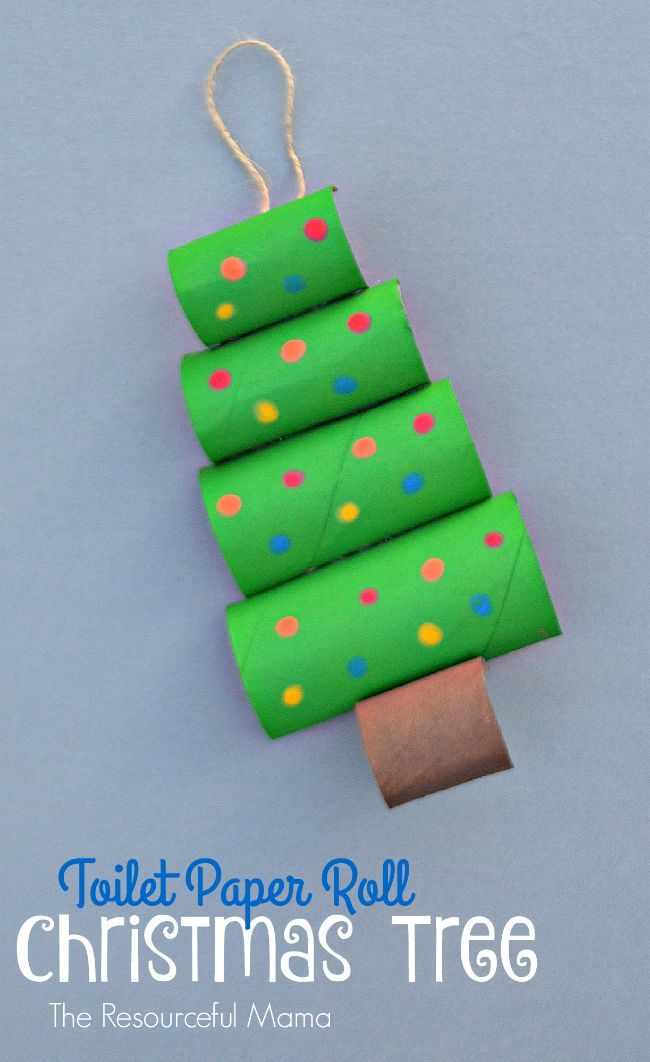 four rolls of toilet paper are wrapped in green and multicolored polka dot pattern