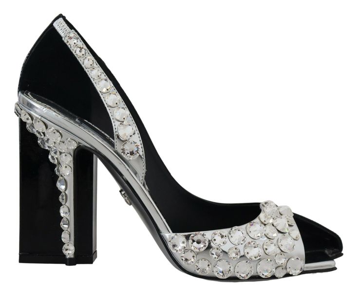 Elevate your fashion quotient with these stunning Dolce & Gabbana leather pumps, adorned with shimmering crystals for an impeccable double design. Perfect for those who seek a blend of luxury and elegance, these heels boast a classic black color with silver accents, adding a touch of sophistication to any ensemble. Expertly crafted in Italy, each pair promises exceptional quality and comfort to carry you with grace throughout any event. Material: 100% Leather Color: Black, Silver Sole: Leather Logo details Country of origin: IT High Heel Stiefel, Dolce Gabbana Shoes, Dolce E Gabbana, Shoe Art, Stiletto Pumps, Silver Crystal, Leather Logo, Silver Material, Silver Accents