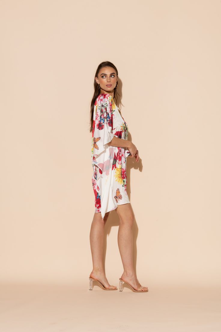 This is one Bouquet you won't want to throw away! Vibrant blooms of flora and fauna adorn this short caftan with tie waist in our signature Polysilk fabric. Dance the night away or lounge in luxe - the occasions are endless with this beautiful, blossoming statement piece. Machine washable for ease of care. Silk V-neck Summer Robe, Spring Beach Cover-up Kaftan With Tie Waist, Spring Vacation Kaftan With Tie Waist, Beachwear Silk Dress With Floral Print, Spring Beachwear Kaftan With Tie Waist, Summer Brunch Dress With Kimono Sleeves, Spring Daywear Dresses With Kimono Sleeves, Summer Kimono Sleeve Dress For Brunch, Spring Summer Daywear Kaftan