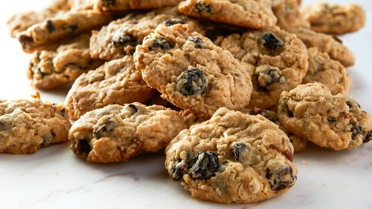 a pile of oatmeal cookies sitting on top of a white countertop