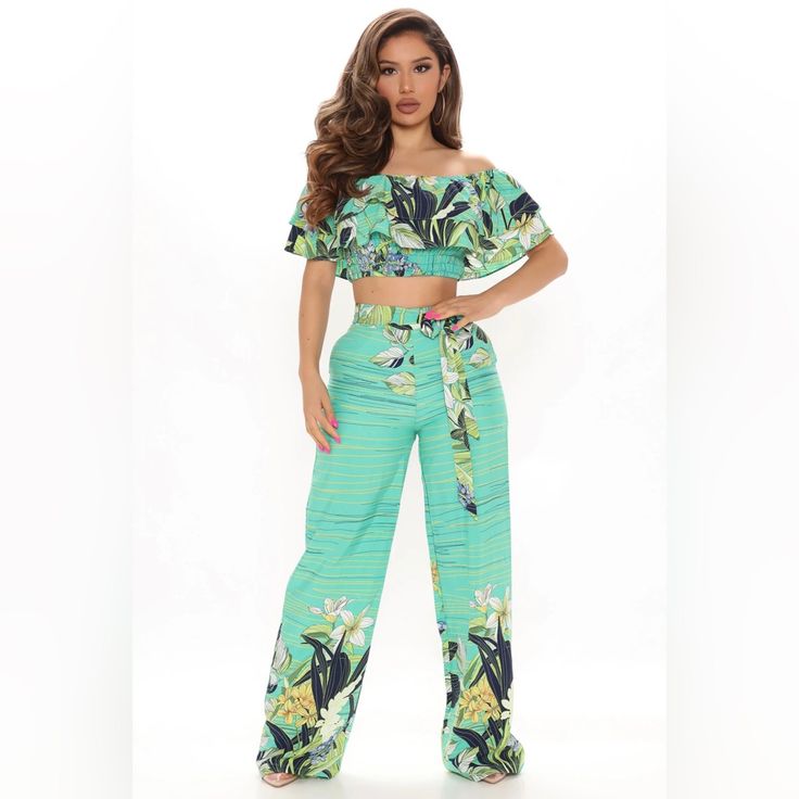 Floral Pant Set Off Shoulder Top Short Sleeve Tiered Detail Smocking Cropped High Rise Pant Tie Waist Detail Wide Leg Pant: Partially Lined 100% Polyester Imported Fitted Pants Matching Set For Vacation, Chic Green Pant Set For Spring, Green Wide Leg Sets For Day Out, Chic Green Floral Print Sets, Chic Green Printed Bottoms, Two-piece Pants For Vacation In Spring, Green Printed Bottoms For Day Out, Chic Green Matching Set Bottoms, Green Wide Leg Matching Set