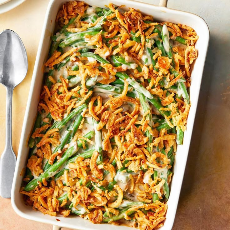 a casserole dish with green beans and onions