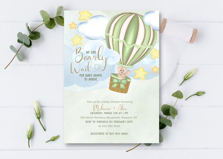 a baby shower with a bear in a hot air balloon