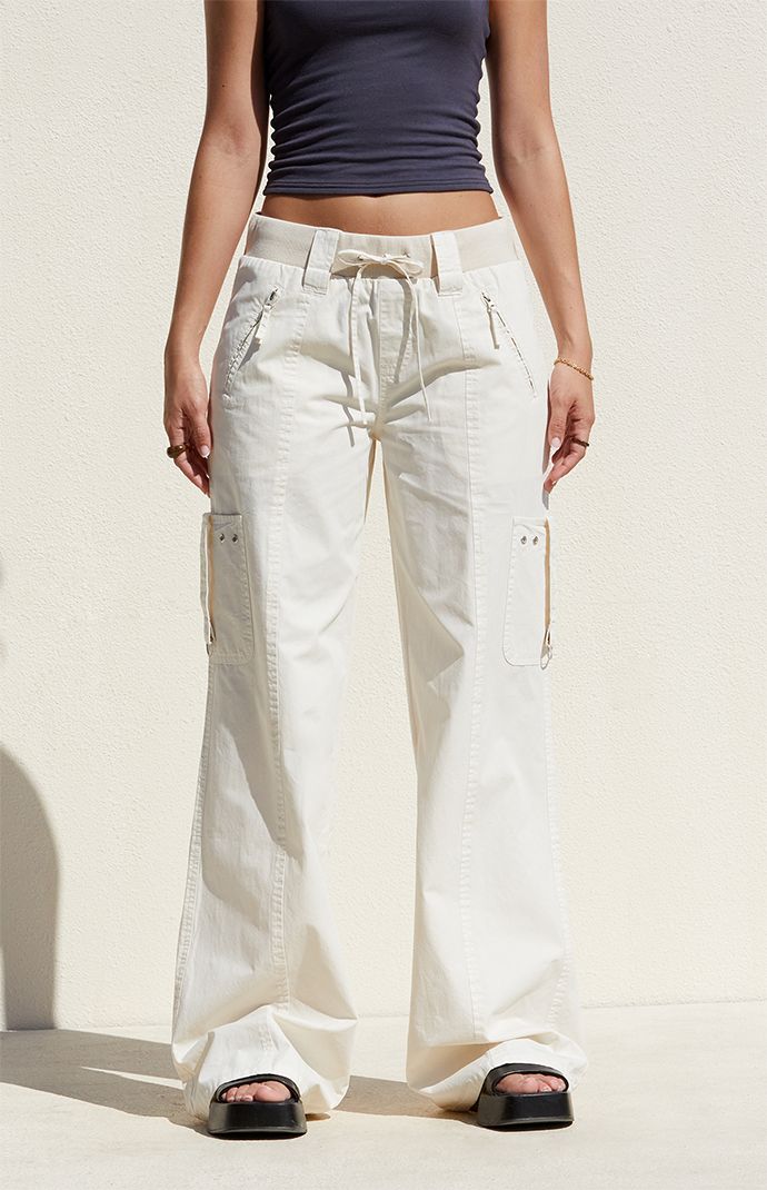 Step out in style with the Bone Low Rise Baggy Flare Pants from PacSun. Designed for both comfort and utility, these pants feature a low-rise fit, ribbed drawstring waistband, and zipper side pockets. Complete with cargo strap pockets on the legs and flared leg openings, they offer a trendy, relaxed baggy look for any occasion. Cool Bottoms For Women, Cute Khaki Pants, Light Pants, Silk Flare Pants, Pants Other Than Jeans, Relaxed Pants, Capsule Wardrobe Pants, Styles Clothing, Utility Wide Leg Cargo Jeans With Drawstring