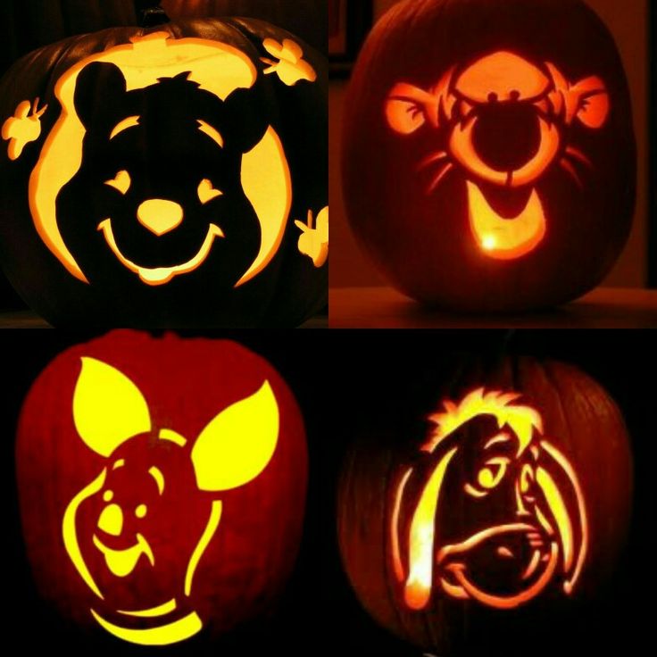 four pumpkins with animals carved into them