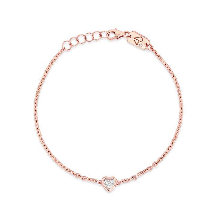 Design A bezel wrapped heart shape diamond on a diamond cut chain. The sweetest gift. Details & Dimensions - 0.25 carats- Adjustable 6.25" - 6.75" length Rose Gold Diamond Cut Chain Bracelet As Gift, Rose Gold Diamond Cut Chain Bracelet Gift, Heart-shaped Rose Gold Diamond Bracelet For Anniversary, Rose Gold Heart-shaped Diamond Bracelet For Anniversary, Rose Gold Heart-shaped Diamond Bracelet, Valentine's Day Rose Gold Diamond Bracelet, Diamond Heart Cut Bracelet As Gift, Heart Cut Diamond Bracelet As A Gift, Heart Cut Diamond Heart Bracelet As Gift