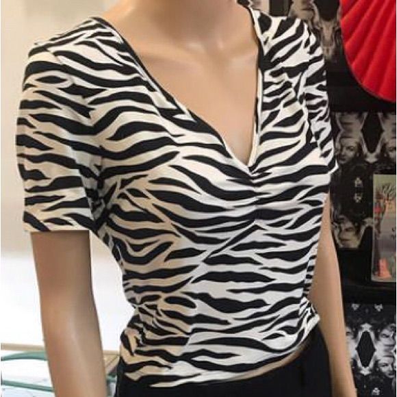 The Zebra Suzie Top Is Yet Another Perfect Cropped Top For Your Collection! This Eye-Popping Zebra Print Is Perfect In This Silhouette; It's Made Out Of A Super Stretchy Double-Brushed Poly Knit, Has A Plunging V-Neckline With Ruching At The Bust, And A Sourpuss Flag Label On The Sleeve. Pairs Perfectly With Any High Waisted Bottom! 96% Polyester 4% Spandex High Waist Bottoms, Crop Tops Women, Zebra Print, High Waisted, Crop Tops, Womens Tops, Black And White, Women Shopping, Black