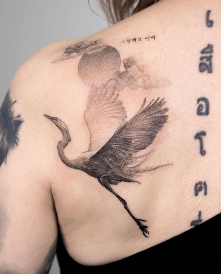 a woman with a tattoo on her back