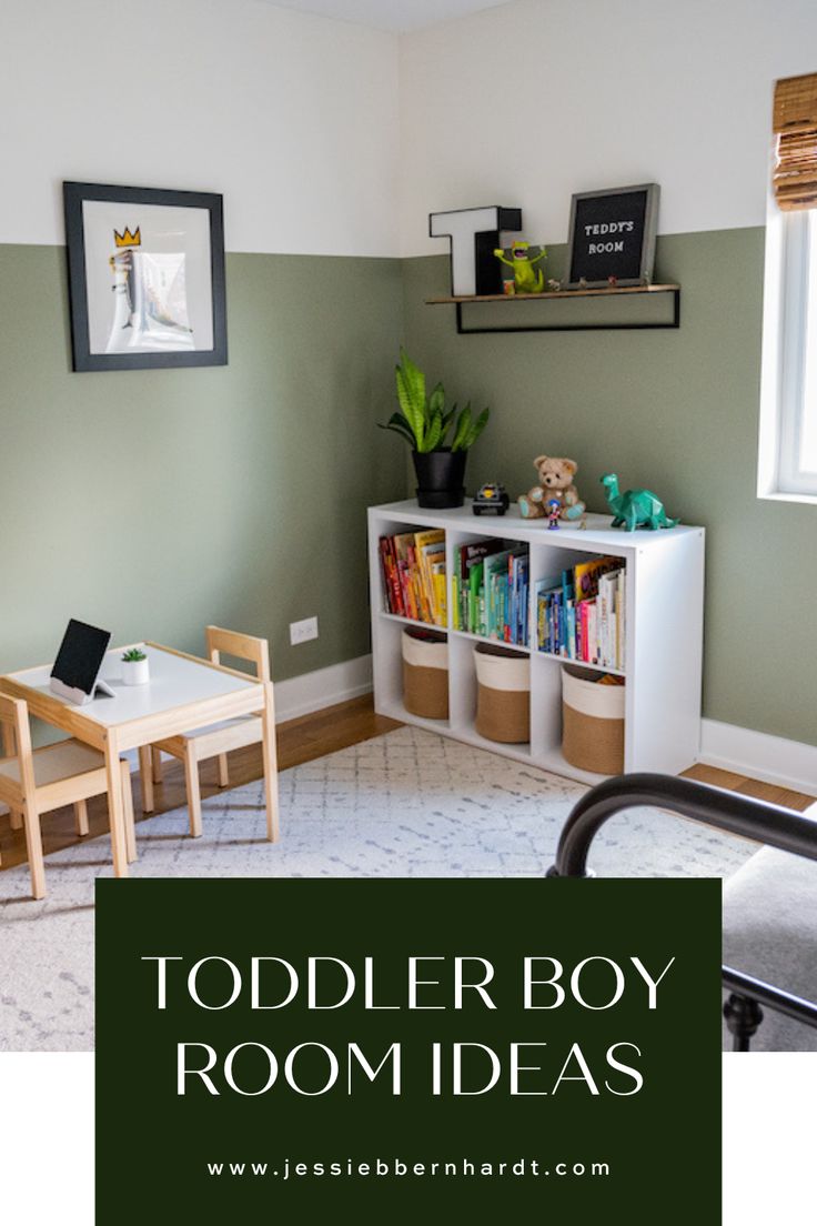 Sage green toddler boy's room with white bookshelf and books organized in rainbow color. Kids Green Bedroom Ideas, Painted Boys Room, Boys Toy Room Ideas, Preschooler Bedroom Ideas, Two Year Old Bedroom Boy Rooms, Gray Toddler Room Boy, Wallpaper Toddler Boy Room, Little Boy Room Colors, Boys Playroom Paint Ideas