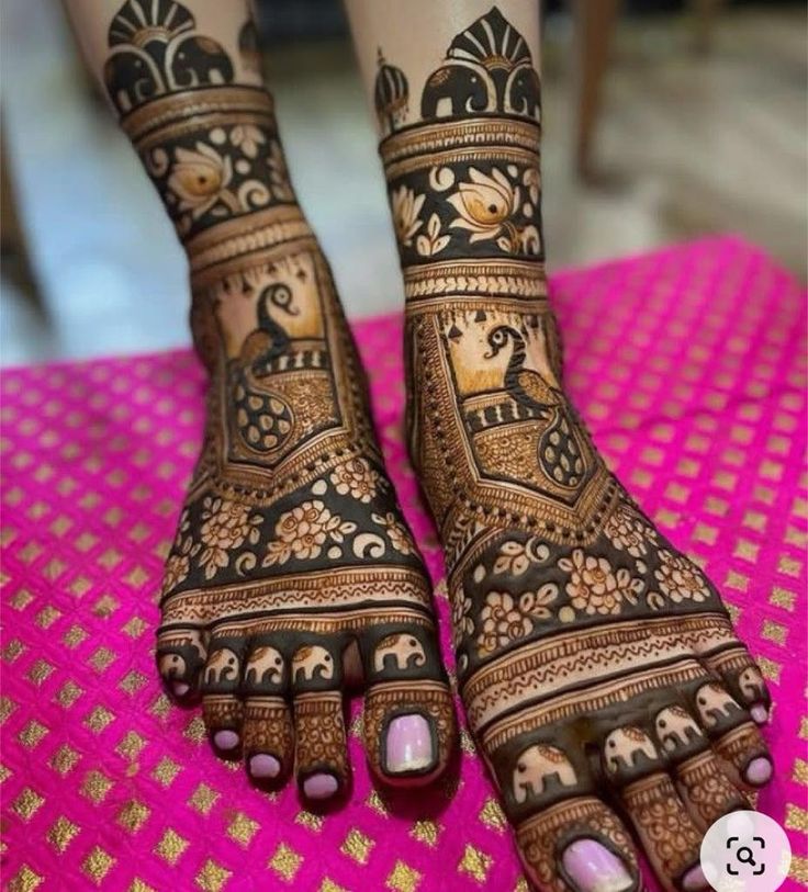 the feet are decorated with henna designs