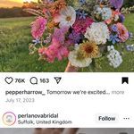 a woman holding a bouquet of flowers in her hand