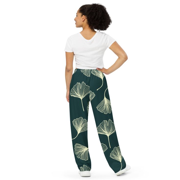 Get the comfort of pajamas in this stylish pair of wide-leg pants. With the adjustable waist and stretchy fabric, it’s like your favorite sweatpants but better. • Relaxed unisex fit • Practical side pockets • Elastic waistband with a white drawstring • Can be worn on the waist or on the hips • Premium knit mid-weight jersey fabric • 95% polyester, 5% elastane (fabric composition may vary by 1%) • Fabric weight: 6.19 oz/yd2 (210 g/m2) (weight may vary by 5%)Size guide WAIST (inches) HIPS (inches) Casual Printed Cotton Wide Leg Pants, Wide Leg Sleepwear With Elastic Waistband, Casual Wide Leg Sleepwear, Green Wide Leg Lounging Pants, Casual Wide Leg Printed Pants, Green Wide Leg Pants For Lounging, Casual Sleepwear With Relaxed Fit Trousers, Trendy Printed Pants With Relaxed Fit, Green Wide-leg Sweatpants For Loungewear