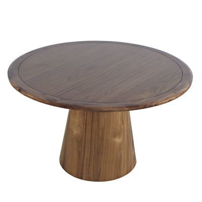 a round wooden table with a wood base