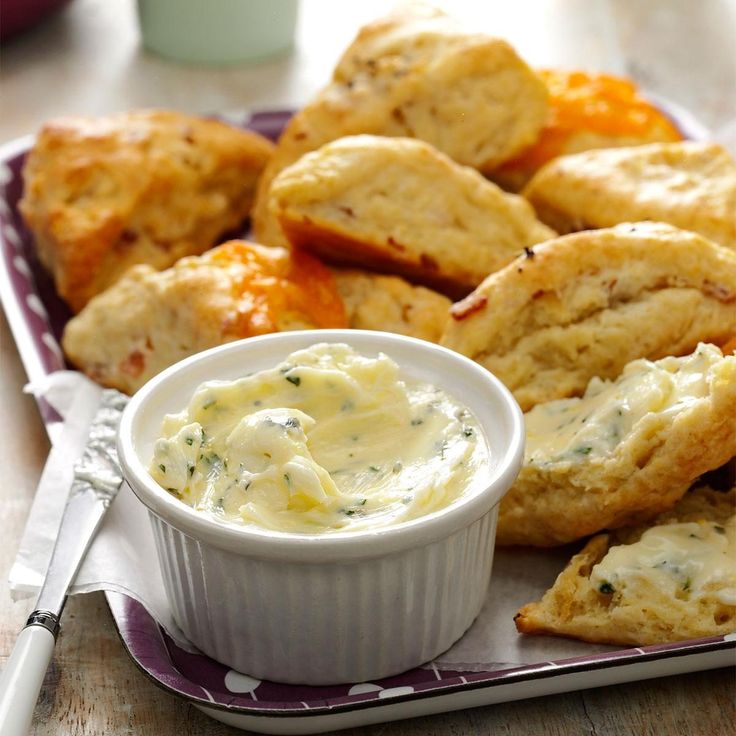 a plate with biscuits and dip on it