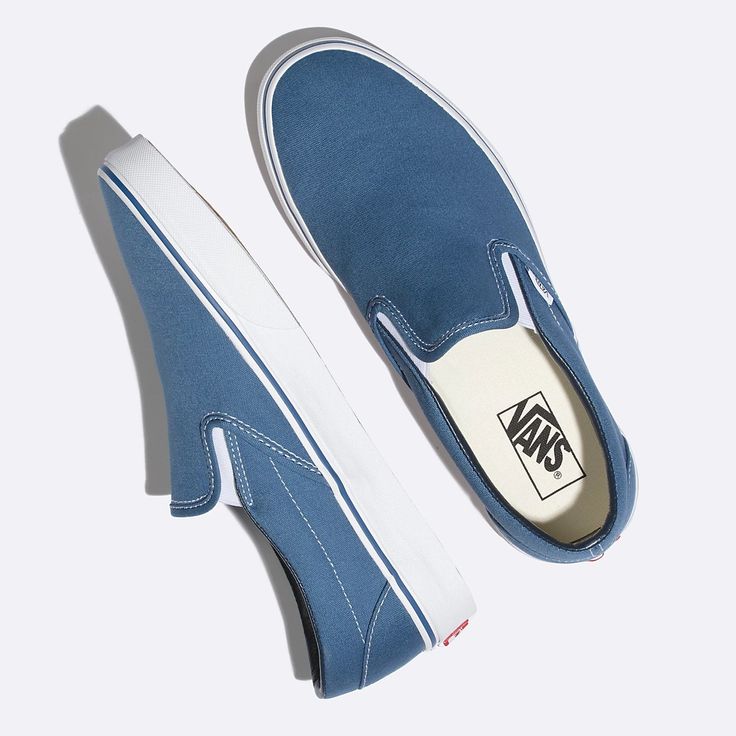 Made with sturdy low profile canvas uppers, the Classic Slip-On is an everyday essential with true “Off The Wall” style. This iconic slip-on shoe also includes supportive padded collars, elastic side accents, and signature rubber waffle outsoles.Details: Mens size listed See size chart for womens sizes Vans style# Vn000eyenvy Blue Slip On Vans, Vans Azul, Estilo Vans, Old Skool Platform, Wall Style, Slip On Vans, Tenis Vans, Blue Vans, Sneakers Vans