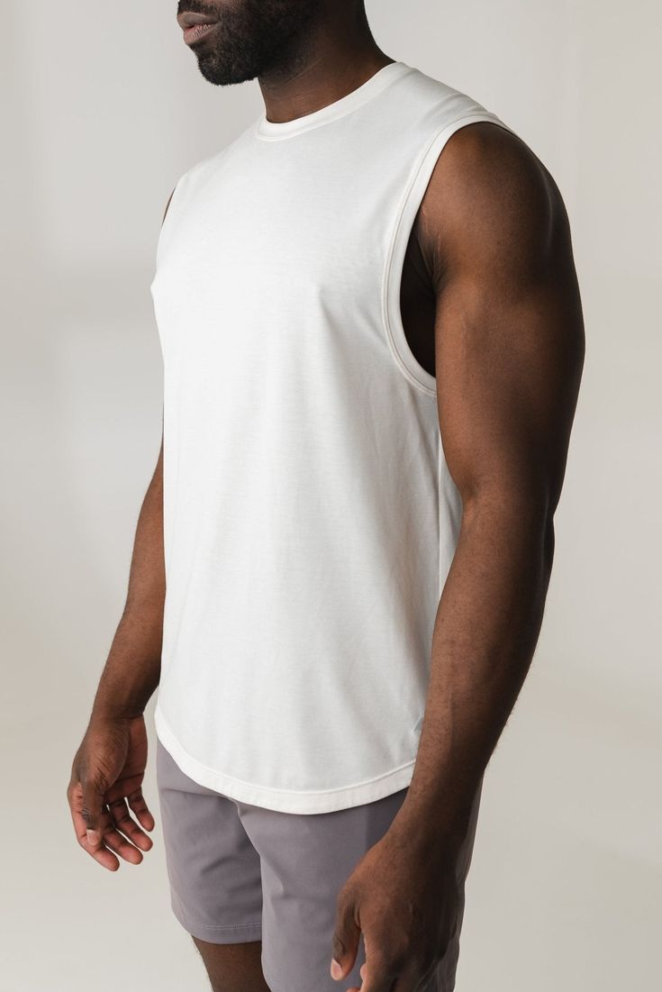 Our Adapt Tank is designed for the ultimate comfort & everyday wear while adding style to your wardrobe. This crew neck tank is a relaxed yet classic fit. Athleisure Cotton Tank T-shirt, Cotton Tank T-shirt For Athleisure, Casual Cotton Racerback T-shirt, Basic Everyday Cotton Tank Top, White Cotton Sporty Tank Top, White Cotton Basic Tank Top, Basic White Cotton Tank Top, Basic Cotton Tank Top For Summer, White Cotton Scoop Neck Vest