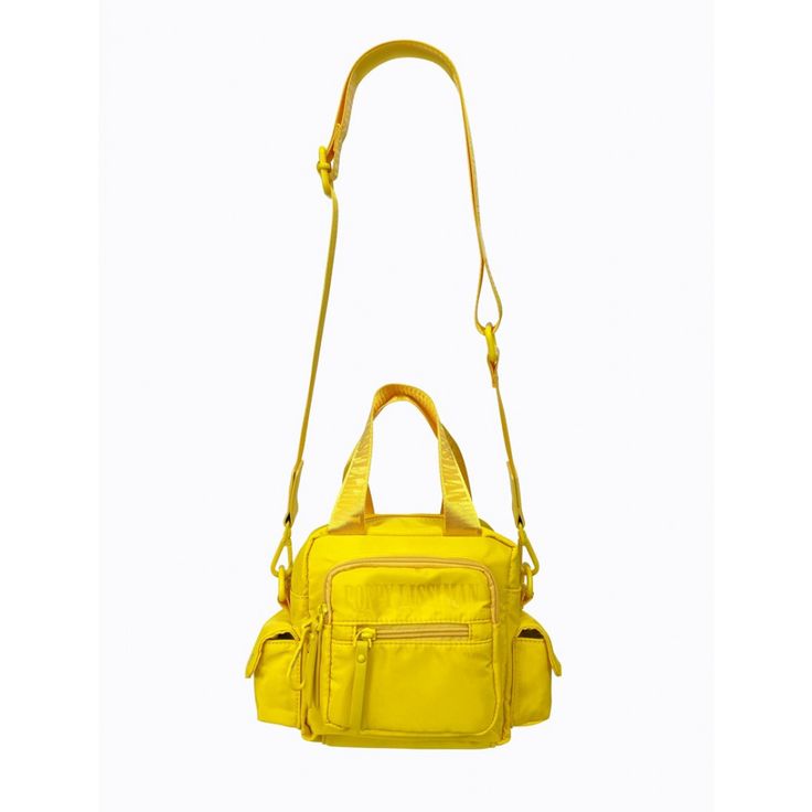 The Block Bag is made from recycled rPET fabric with matching yellow powder-coated hardware, carabiner and faux leather zip pullers. With a short nylon strap and an extra adjustable long nylon strap, this bag provides versatility and can be worn on the arm, or as a cross-body bag. This bag features an internal and external zip pocket, a front two section compartment, and two side compartments to provide added practicality. * rPET fabric is made from recycled post-consumer plastics otherwise dest Poppy Lissiman, Zip Puller, The Block, Body Bag, Powder Coated, Cross Body, Sunnies, Zip Pockets, Shoulder Strap