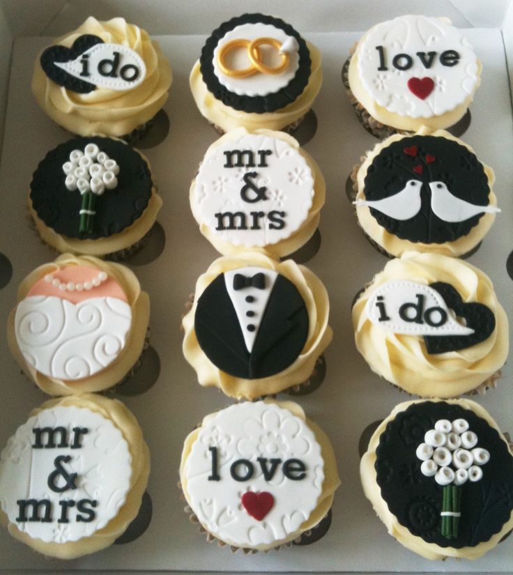 cupcakes decorated with wedding decorations in a box