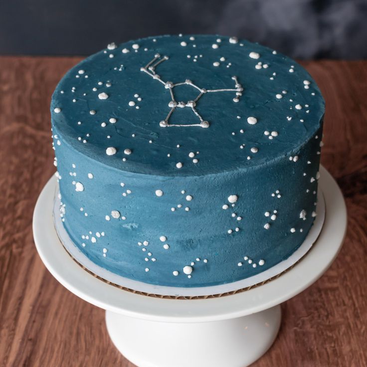 a blue cake with white stars on it