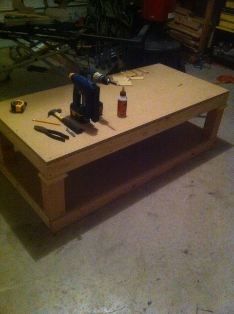 a workbench with tools sitting on top of it